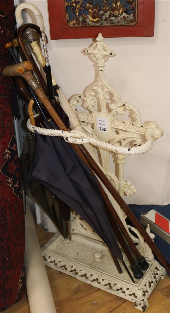 A Victorian white painted cast iron stick and umbrella stand